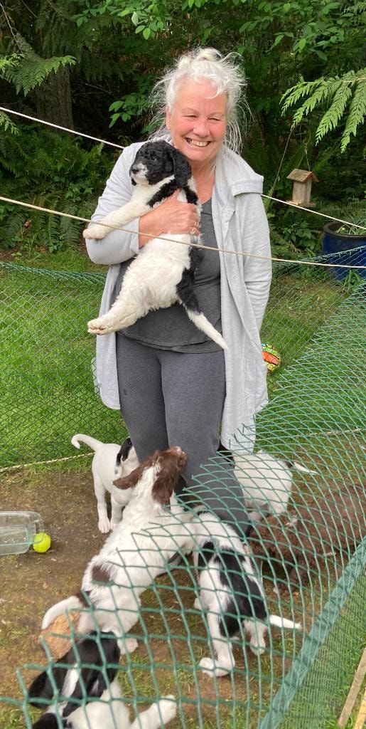 Our breeder with a Labradoodle puppy